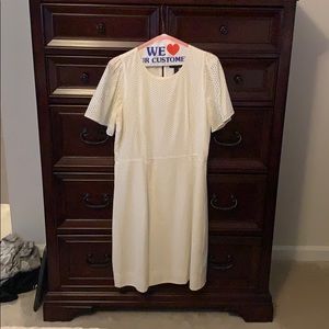 White eyelet below the knee dress.